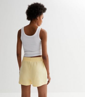 Pale yellow hot sale adidas shorts