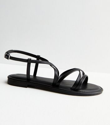 Flat black store flip flop sandals