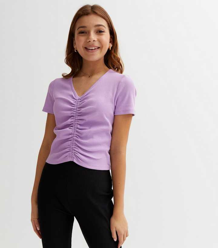 What can I wear under a buttoned light purple crop top? I was