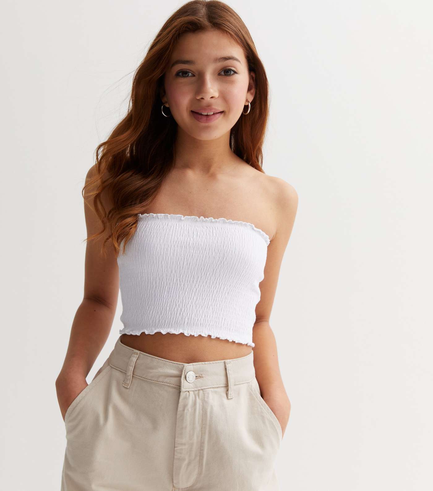 https://media2.newlookassets.com/i/newlook/855207710/girls/clothing/tops/girls-white-shirred-bandeau-top.jpg?strip=true&w=1400&qlt=60&fmt=jpeg