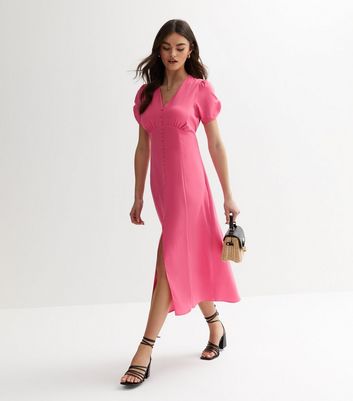 Pink dress with store buttons down the front