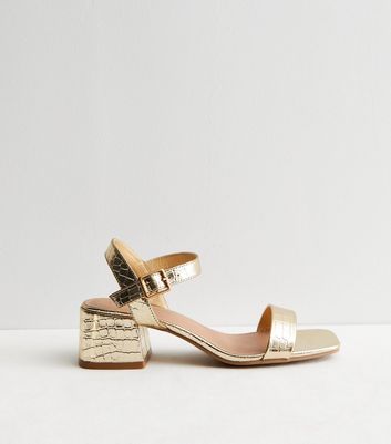 low block heel gold shoes