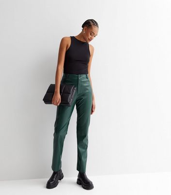 tall dark green leather look trousers