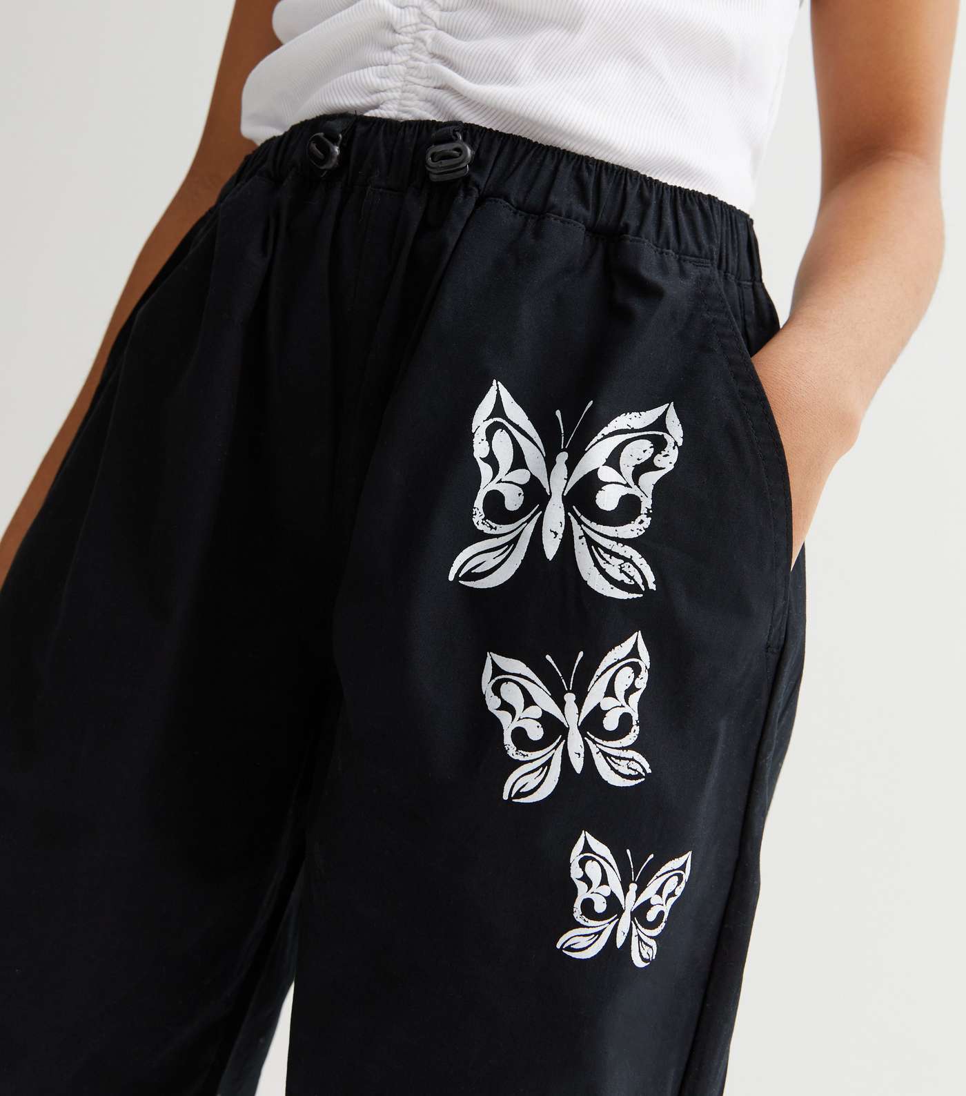 Girls Black Butterfly Los Angeles Logo Parachute Trousers Image 3
