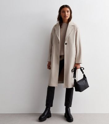 Cream knee store length coat