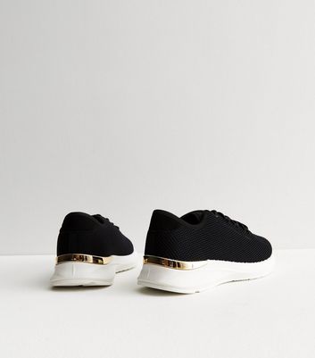 Black sneakers shop with gold trim