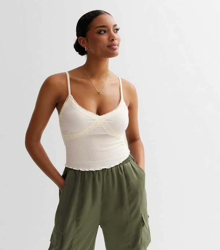 https://media2.newlookassets.com/i/newlook/864740012M1/womens/clothing/tops/off-white-crinkle-lace-trim-cami-top.jpg?strip=true&qlt=50&w=720