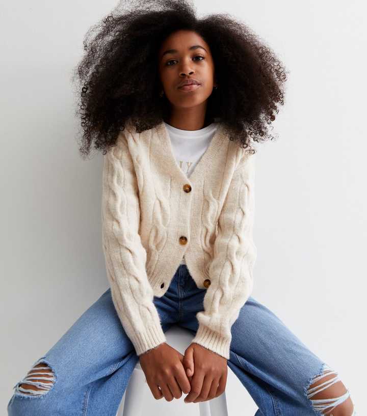 https://media2.newlookassets.com/i/newlook/864814314/girls/girls-clothing/jumpers-and-cardigans/girls-cream-cable-knit-cardigan.jpg?strip=true&qlt=50&w=720