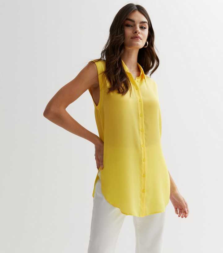 yellow sleeveless blouse
