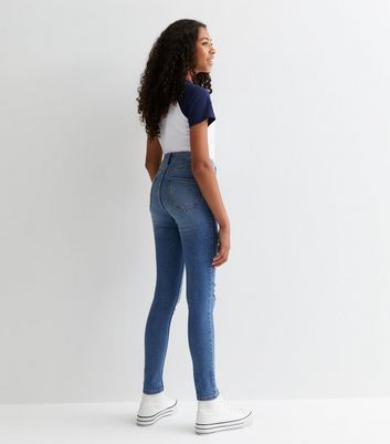 Skinny girl in hot sale high waisted jeans