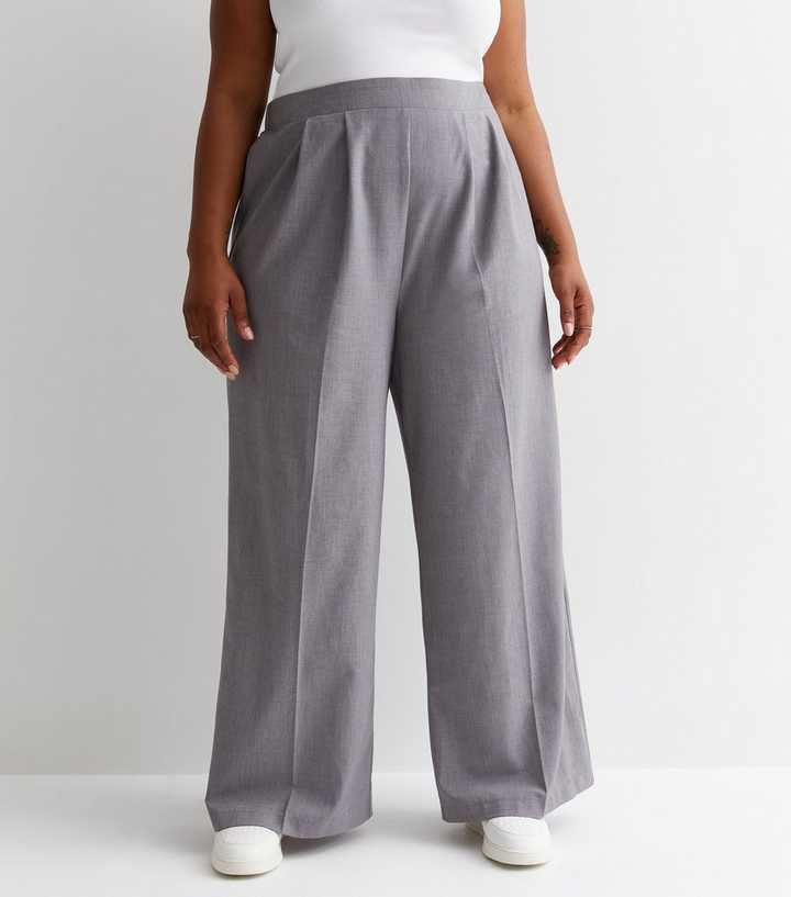 https://media2.newlookassets.com/i/newlook/869782802M1/womens/clothing/trousers/curves-pale-grey-wide-leg-trousers.jpg?strip=true&qlt=50&w=720