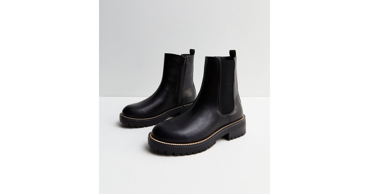 chelsea boots with gold trim