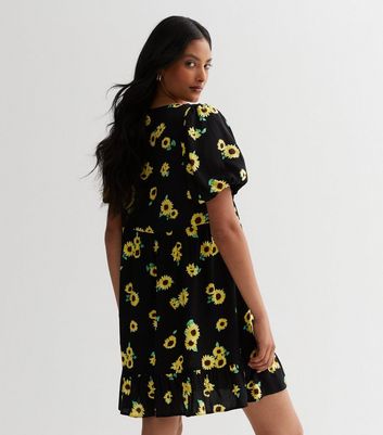 Black dress shop with sunflower print