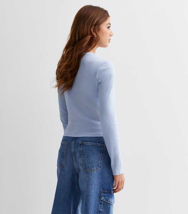 pale blue long sleeve top