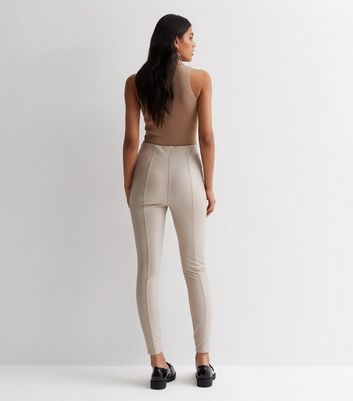 https://media2.newlookassets.com/i/newlook/874519212M3/womens/clothing/leggings/off-white-leather-look-high-waist-leggings.jpg