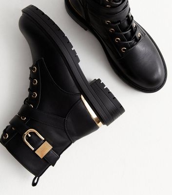 Black combat boots with gold cheap buckles