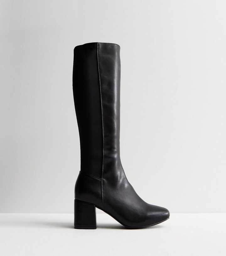 https://media2.newlookassets.com/i/newlook/876521401/womens/footwear/boots/wide-fit-black-leather-look-stretch-block-heel-knee-high-boots.jpg?strip=true&qlt=50&w=720