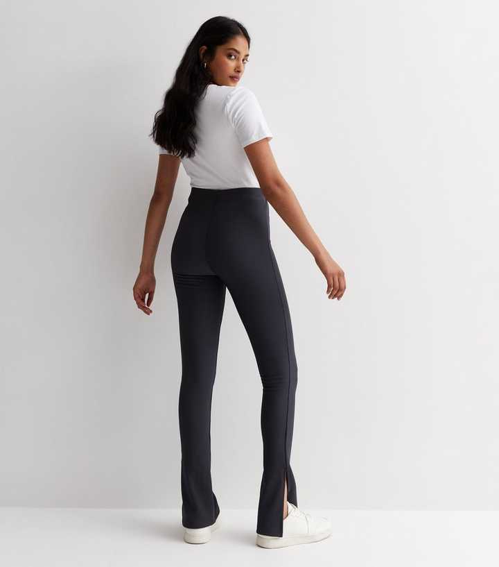 https://media2.newlookassets.com/i/newlook/877571203M3/womens/clothing/leggings/dark-grey-ribbed-split-hem-flared-leggings.jpg?strip=true&qlt=50&w=720