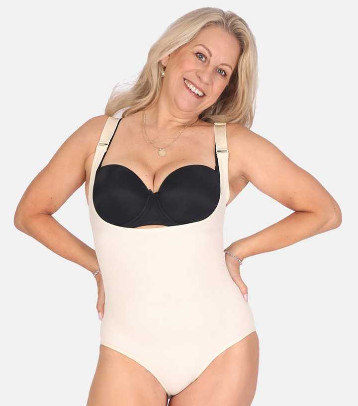 https://media2.newlookassets.com/i/newlook/880907572/womens/clothing/lingerie/conturve-pale-pink-open-bust-shaping-bodysuit.jpg?strip=true&qlt=50&w=720