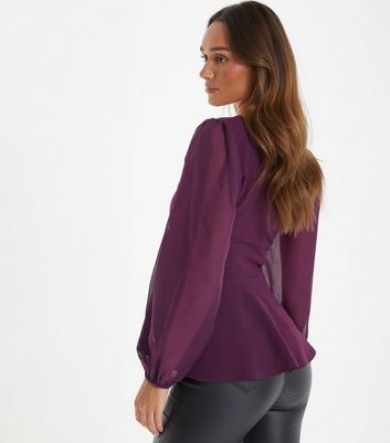purple peplum top with black liquid leggings