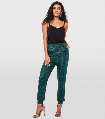Buy Green Sequined Lycra Embroidered Dazzling Tapered Trouser For Women by  B'Infinite Online at Aza Fashions.