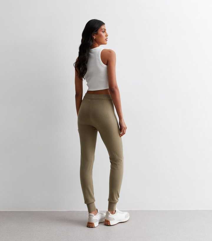 https://media2.newlookassets.com/i/newlook/882909121M3/womens/clothing/womens-activewear/gini-london-light-brown-high-waist-cuffed-leggings.jpg?strip=true&qlt=50&w=720