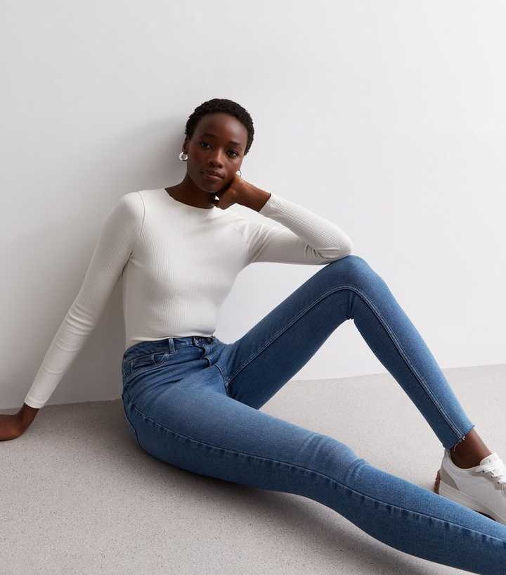 https://media2.newlookassets.com/i/newlook/883225140/womens/clothing/jeans/tall-blue-raw-hem-hallie-disco-super-skinny-jeans.jpg?strip=true&qlt=50&w=720