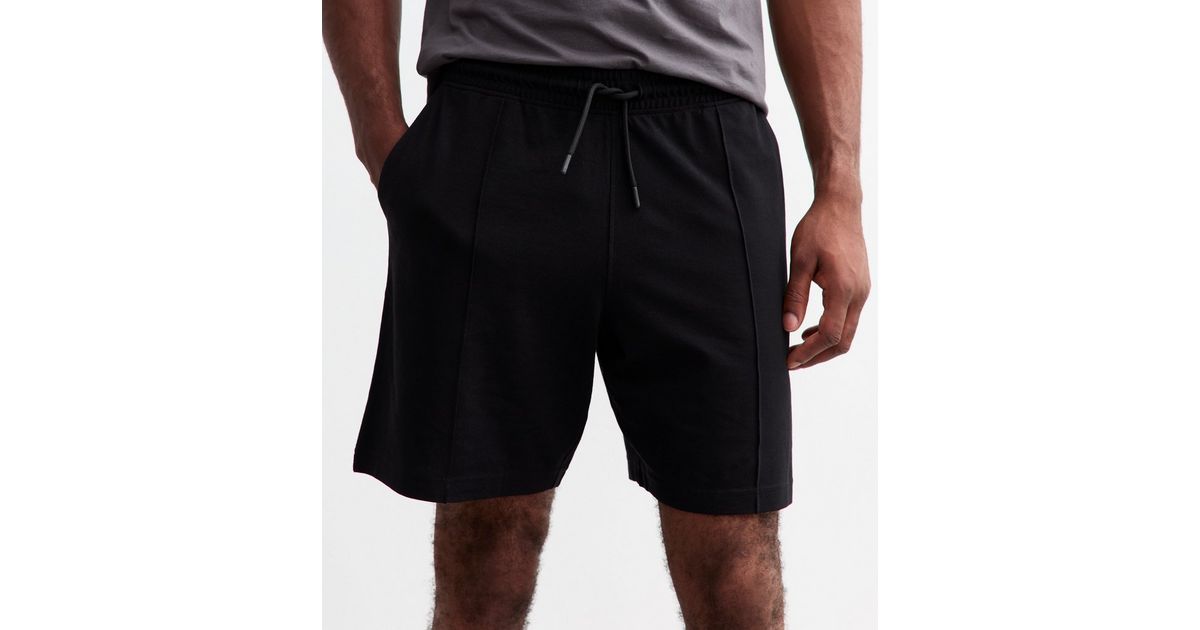 Solid high waist pleated rolled cuff hem pintuck shorts. main image 1