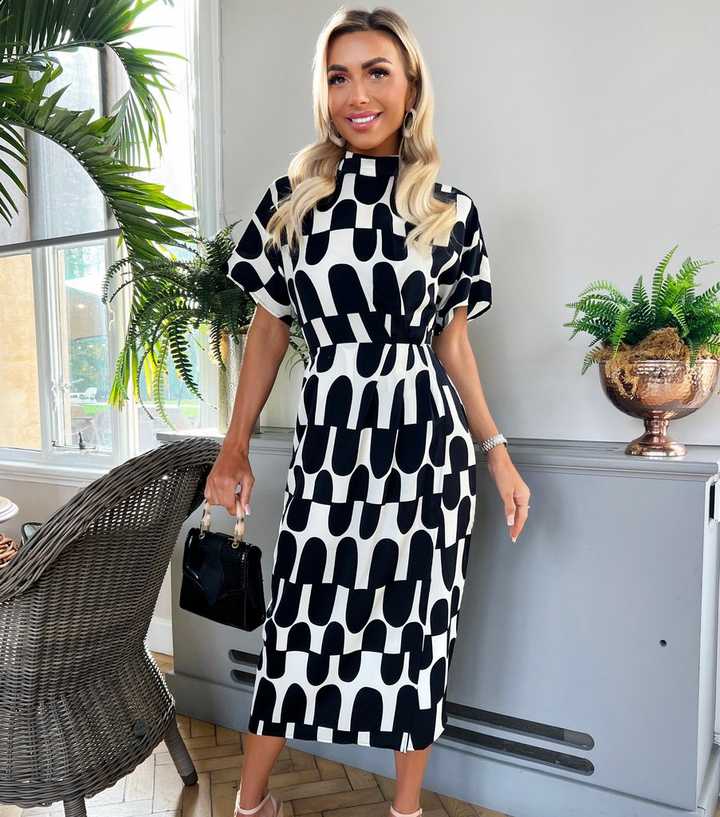 midi black and white dress Women's Floral Print Smocked Midi Dress - White Medium | Women's Online Boutique | Boho Chic Style main image 1