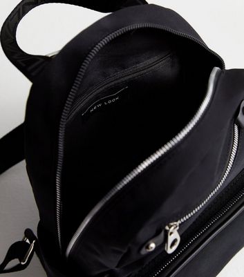 Black backpack hotsell with silver zippers