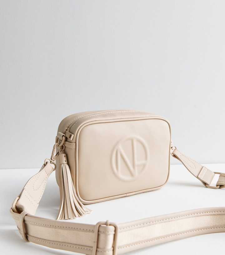 cream cross body bag