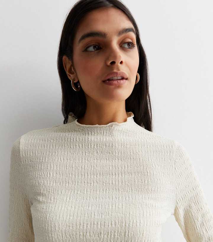 Cream Textured Frill Hem Long Sleeve Top