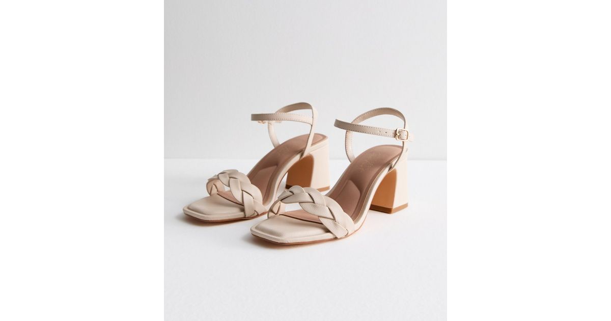 white plaited sandals