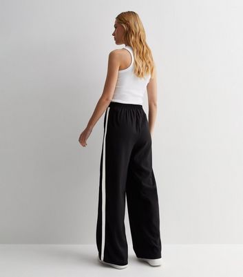 Womens SANDRO black High-Rise Side-Stripe Trousers | Harrods UK