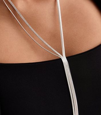 Long silver necklace with on sale tassel