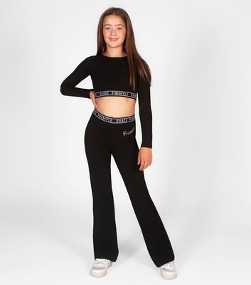 Girl in crop 2024 top and sweatpants