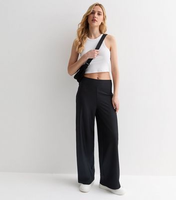 Bell-bottom jersey-knit trousers | Women's trousers | Cortefiel