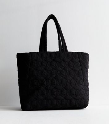 Black quilted tote on sale