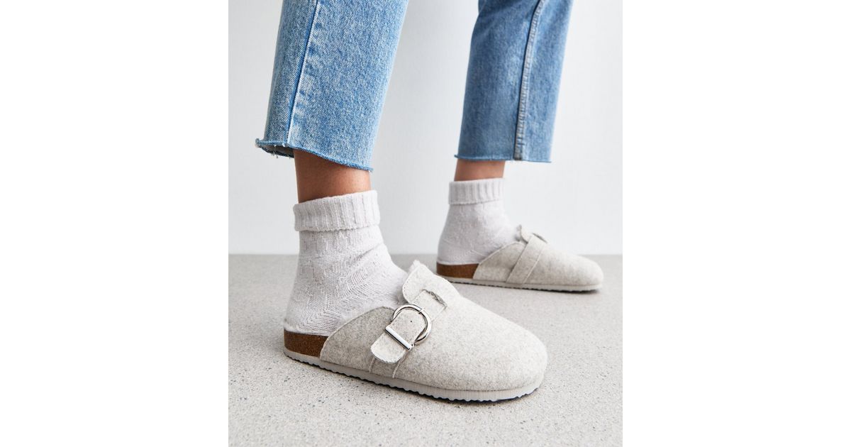 fur lined black mules