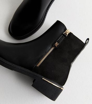 Black boots with gold zip best sale