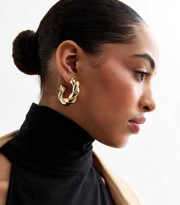 Gold Tone Twisted Hoop Earrings