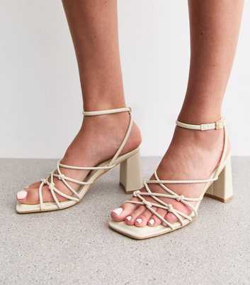 Off White Faux Leather Knotted Strap Block Heel Sandals