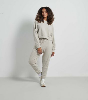 Rise by Zara McDermott Stone Chunky Knit Joggers New Look