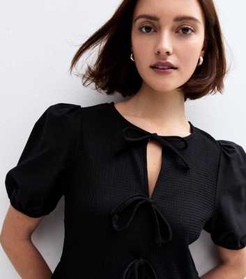 Black Tie Neck Peplum Top