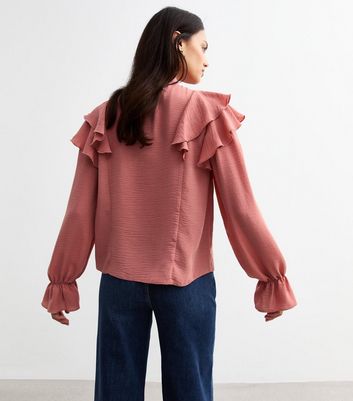 pink ruffle neck blouse
