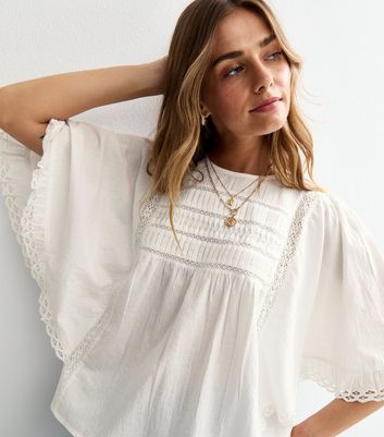 white batwing blouse