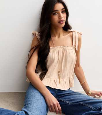 Stone Textured Tiered Hem Tie Strap Top