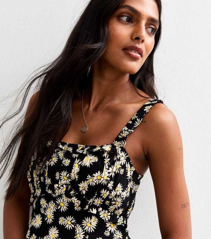 black dress with daisies Anela Midi Dress in Daisy Mix Black main image 0