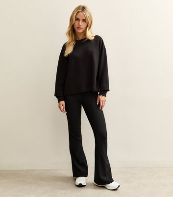 Petite Black Ribbed Jersey Flared Trousers New Look