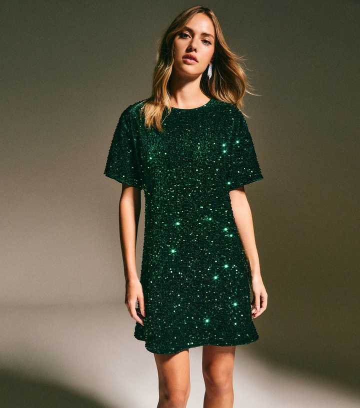 green emerald velvet dress Carella Bottle Green Velvet Twisted Asymmetric Midi Dress – Club L London
